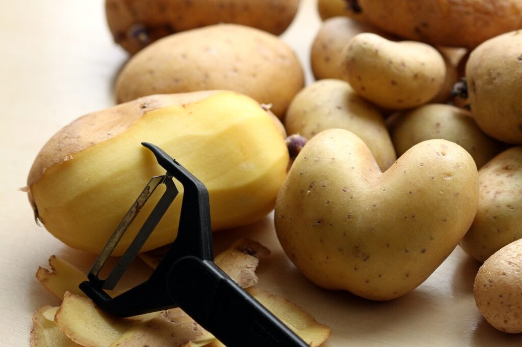 A Pile Of Peeled Potatoes.